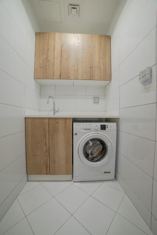 Platinum Coast Hotel Apartments Fujairah Ngoại thất bức ảnh A washing machine in a laundry room